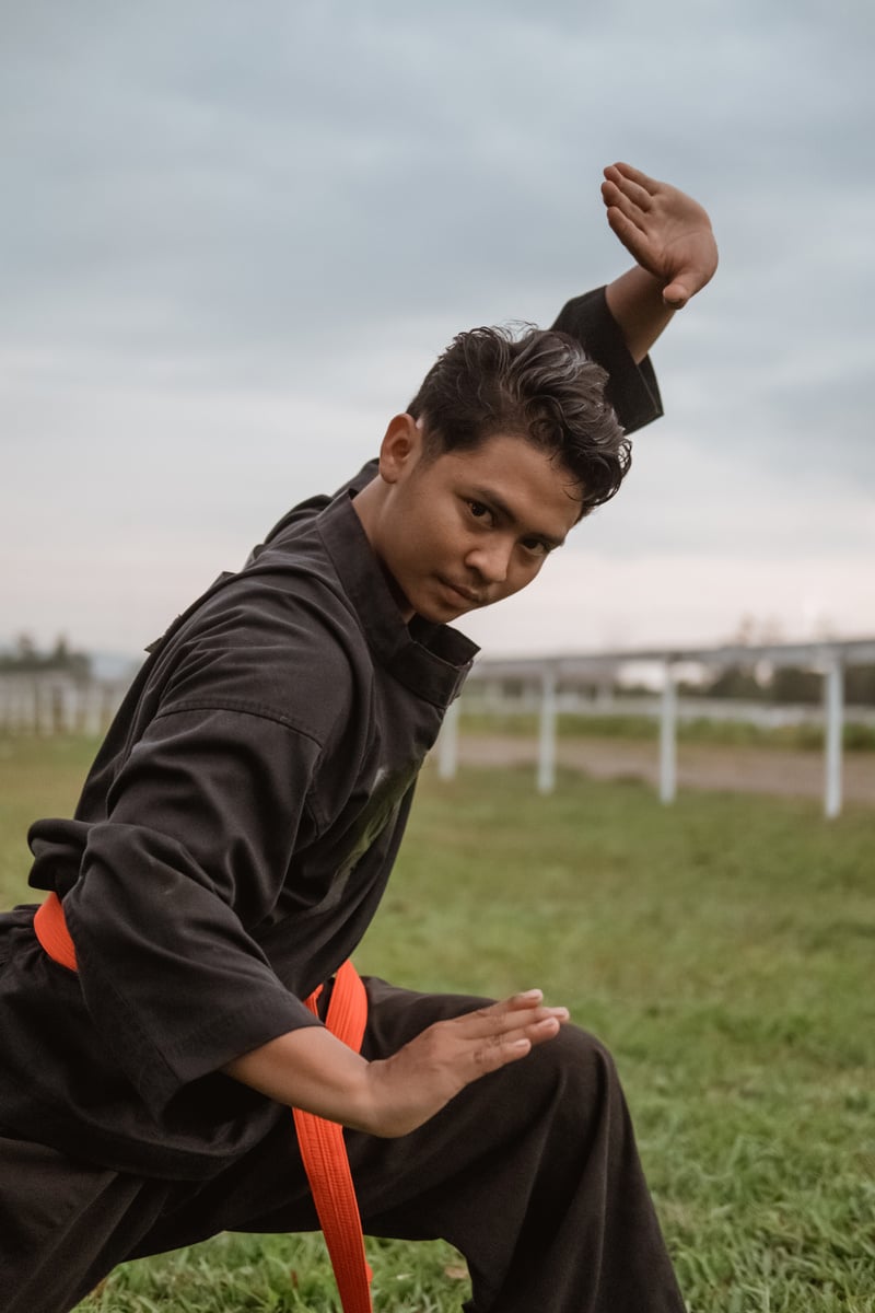 Asian Men Wearing Pencak Silat Uniforms with Pasang Movements